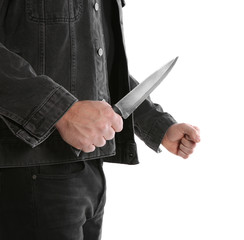 Man with knife on white background, closeup. Dangerous criminal