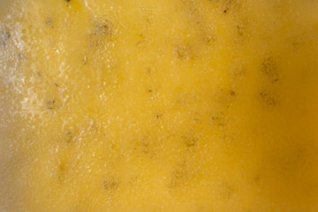 juicy appetizing marmalade made of yellow kiwi blurred closeup. sweet blurred background