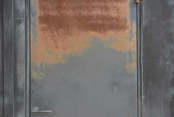 Rusty red on a black iron door.