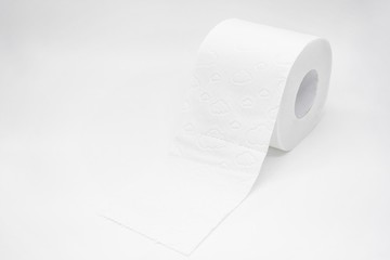 Roll of white toilet paper with perforation on a white background