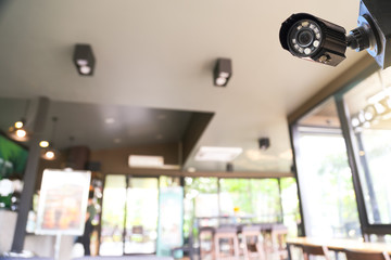 Closed-circuit television, Security CCTV camera or surveillance system in a coffee shop.