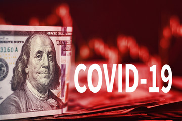 US dollar bills on a background with dynamics of exchange rates. Trading and financial risk concept