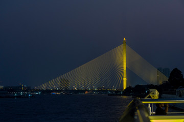 Fototapeta na wymiar Rama VIII Bridge, Bangkok, from aboard the Chao Phraya River