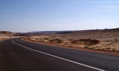 Fototapeta na wymiar Panorama of the Sinai desert with an asphalt road. The mountains and Sands