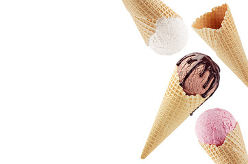 Border of different ice cream cones in waffle flying - white, pink, brown with chocolate sauce isolated on white.