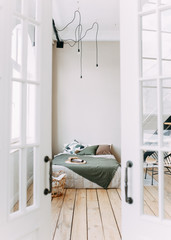 Scandinavian style bedroom design, light room, bed, stairs, chair, modern minimalist interior, eco-friendly , decorative elements, spring, tropics, large Windows , plants, wooden floors © Елизавета Старкова