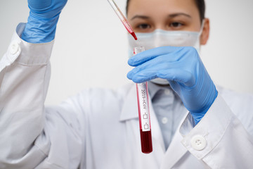 the epidemiologist takes blood tests for coronavirus.