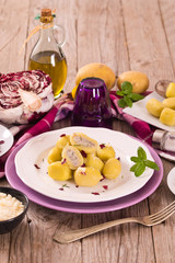 Potato gnocchi stuffed with radicchio and ricotta.