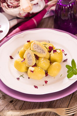 Potato gnocchi stuffed with radicchio and ricotta.