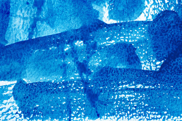 watercolor paper and blue watercolor paint. wet watercolor paper. abstract blue background. blue...