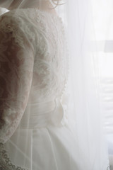 details of the bride in the wedding dress