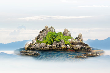 Island, mountains, trees and small boats in the middle of the sea