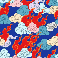 .Clouds and forks of flame on a blue background. Vector seamless pattern.