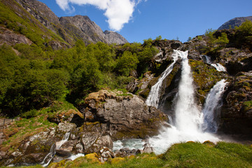 Fototapeta na wymiar Waterfall from the Briksdalsbreen Glacier, the most popular in Norway