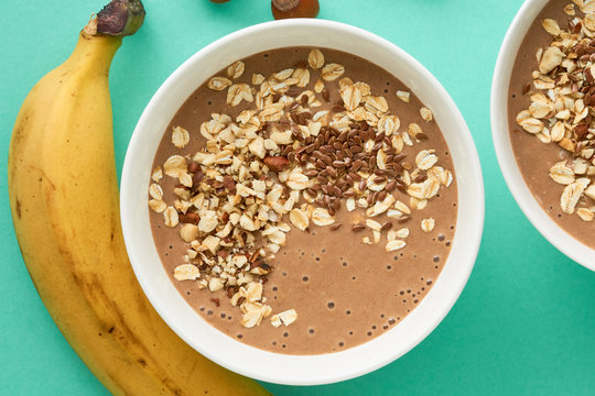 Chocolate smoothie bowl with oatmeal and flax seeds