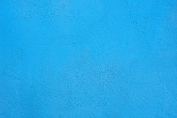 Background of a blue painted cement wall, rough cast of cement and concrete wall texture, decorative rustic coating