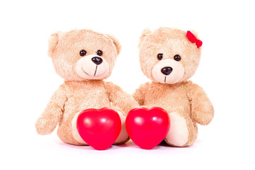 Red heart and two teddy bears sit on white background. Love and relationship concept. Valentines concept.