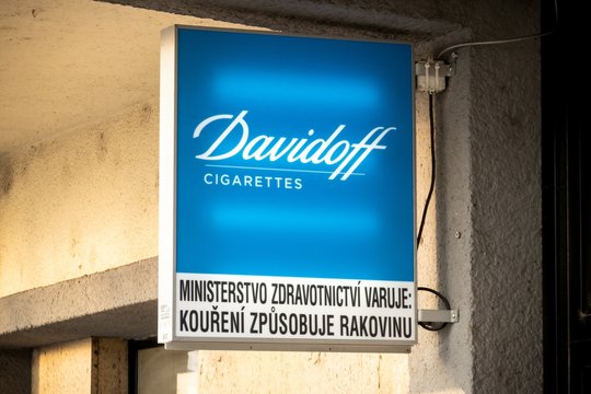 The banner of Davidoff cigarettes under the roof of small local tobacco store with a healt warning written in Czech language