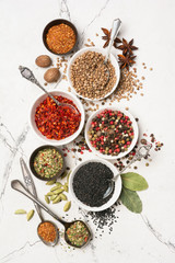 Different spices, kitchen herbs and seeds for tasty meals