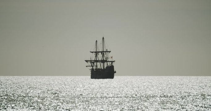 Christopher Columbus caravel replica ship sails in the mediterranean sea at sunrise