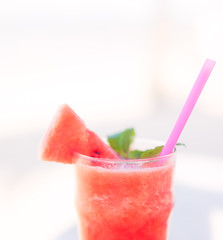 Smoothie menu drink of watermelon smoothie.Summer drink concept.Glass of healthy delicious watermelon juice isolated on a white background with melon slice.