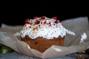 Easter composition with sweet bread, kulich and eggs on light background.