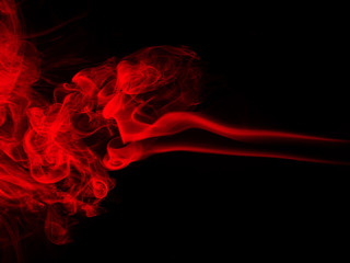 Red smoke abstract on black background for design, darkness