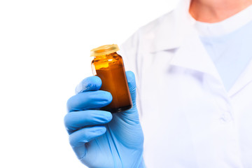 Doctor hand in sterile gloves holding glass vial isolated on white background  - image