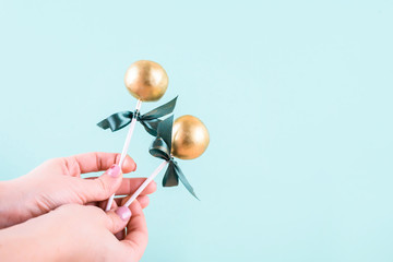 Delicious and beautiful cake pops on an abstract background.