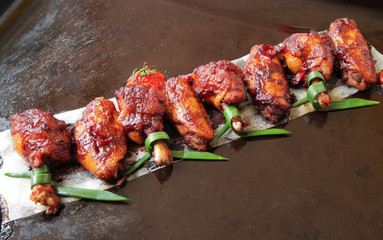  baked chicken wings with spices, tomato and soy sauce