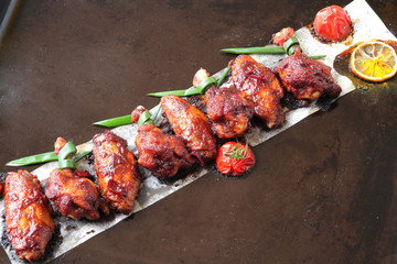  baked chicken wings with spices, tomato and soy sauce