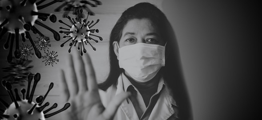 Indian Doctor wearing surgical mask for protect Coronavirus covid-19 and show stop hands gesture for stop corona virus outbreak.Scientist in biological protective Pandemic virus outbreak concept.