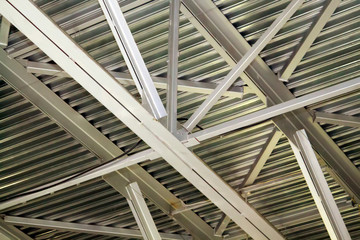 close-up view of the connection of metal beams. strong iron construction made of channels that holds the roof