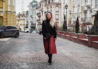 beautiful young woman walking on the street