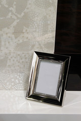 elegance silver photo frame on marble shelf