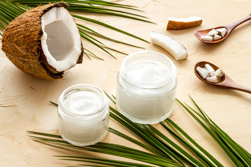 Obraz na płótnie Canvas Homemade coconut cream - still life with spoon - on beige background