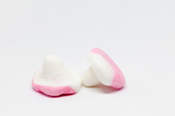 two candy mushrooms in pink and white