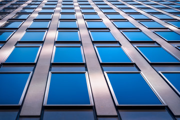 Glazing panel patterns and textures at a high rise office building curtain wall at Castlereagh Street in Sydney CBD, Australia.