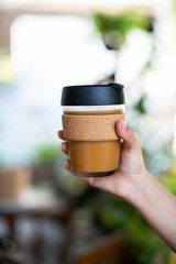 Female hands hold reusable coffee cup, Sustainable Eco friendly lifestyle concept..