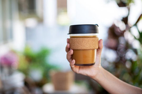 Female hands hold reusable coffee cup, Sustainable Eco friendly lifestyle concept..