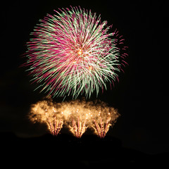 Red and green over gold fireworks