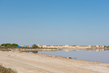 Tourists visiting Salins du Midi (Aigues-Mortes, Camargue) on a little train