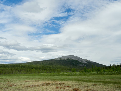Beautifull summer scene with idyllic Yll&auml;s fell in the background in &Auml;k&auml;slompolo, Kolari, Finland