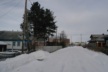 Fototapeta premium village street in winter in the North