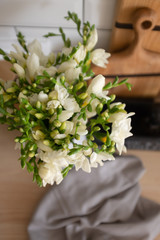 Beautiful bouquet of white flowers in a vase in a modern Scandinavian interior. 