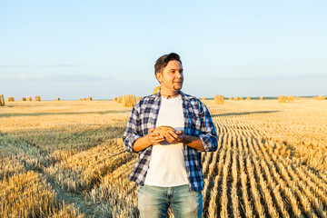 successful agriculturist in field of wheat. harvest time