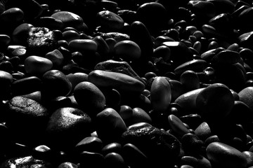 Background with black stones softly rounded - toned image
