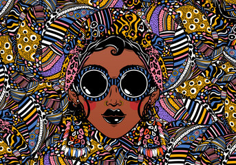 Beautiful African woman in cool urban style with ethnic elegant geometric glasses, earrings on a rythmic background.