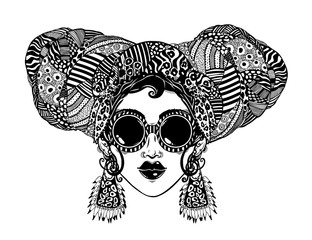 Young urban fashionable beautiful woman in cool ethnic style with elegant geometric glasses, earrings and head wrap.