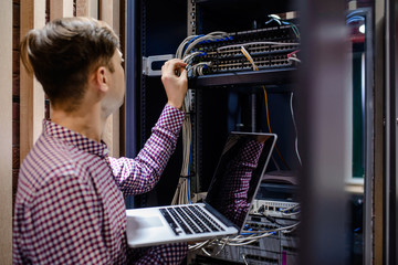 In the server room a technician